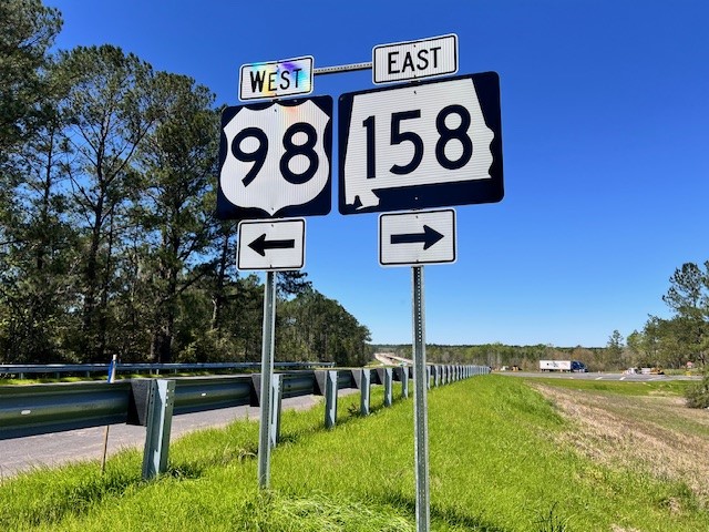 Road signs at the intersection of US-98 and SR-158 Mobile County
