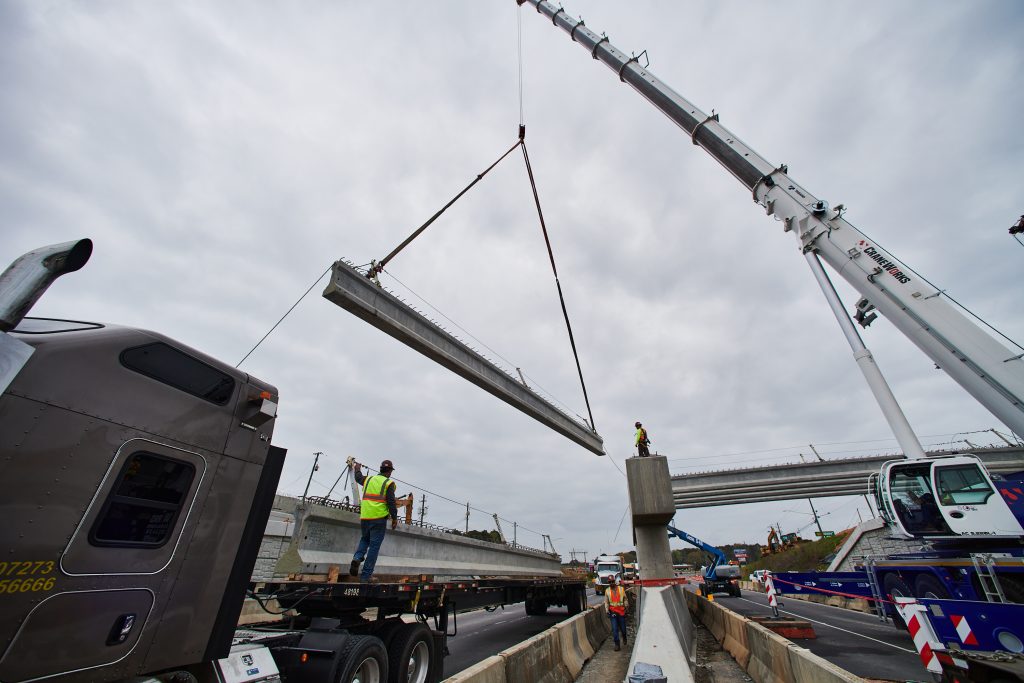 Workers place girders on the SR-5 bridge in Jasper