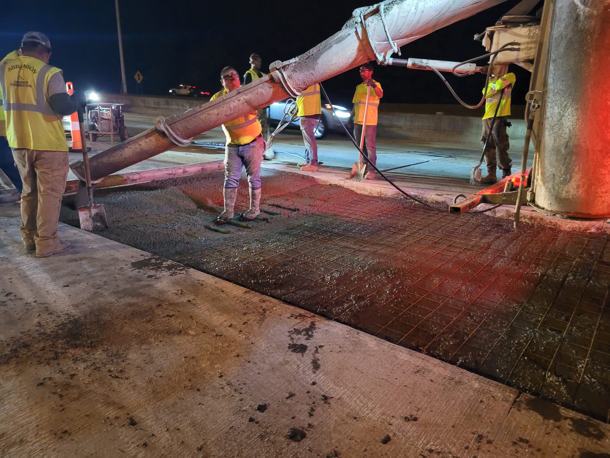 crews pouring asphalt on I-65 in Jefferson County