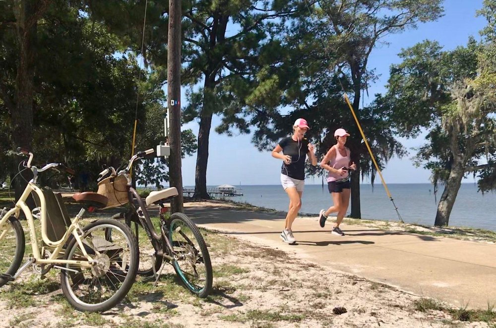 Joggers on the Eastern Shore Bicycle and Pedestrian trail in Baldwin County