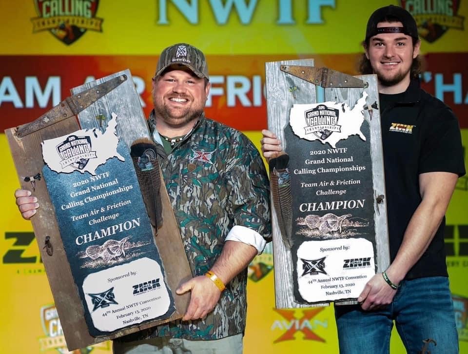 Terence Williamson, left, and his teammate pose with the 2020 Grand National Calling Championship trophy