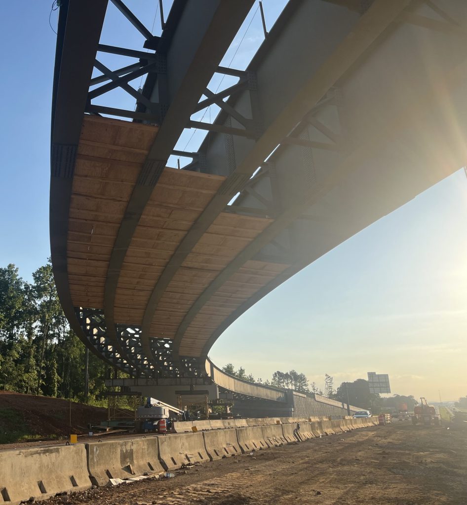 Large steel beams extend from the abutment of the ramp