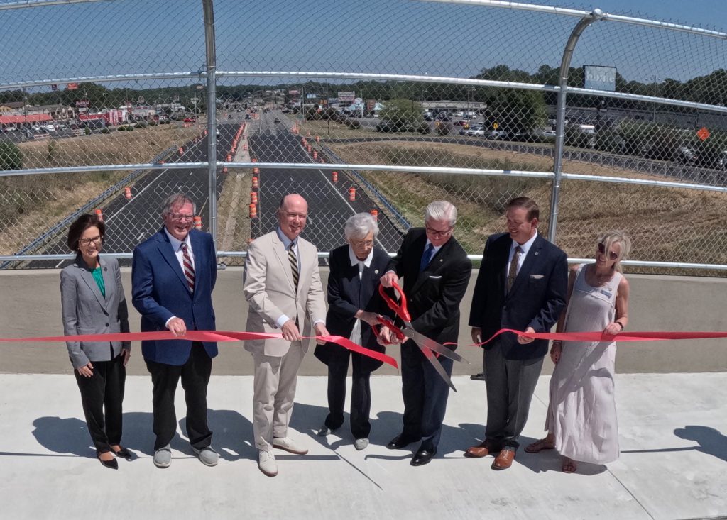 Governor Kay Ivey and memebers of the Federal and State Legislation as well as Jasper City Council members cut the ribbon opening the new bridge on SR-5 over US-78A