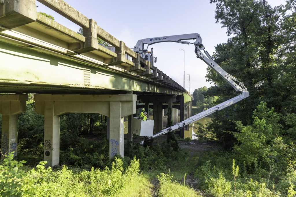 ALDOT crew members look for bats under the Woolsey Finnell Bridge in Tuscaloosa on August 3, 2024.