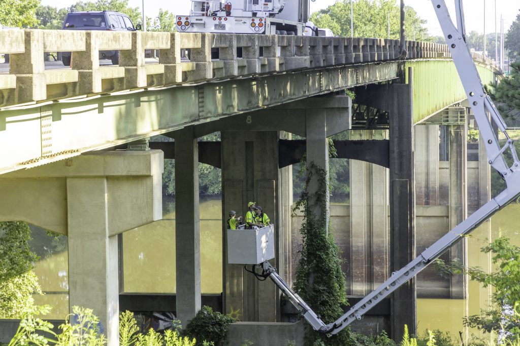 ALDOT crew members look for bats under the Woolsey Finnell Bridge in Tuscaloosa on August 3, 2024.