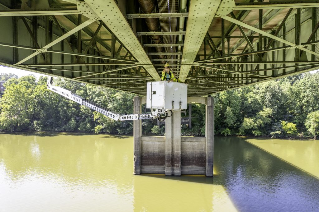 ALDOT crew members look for bats under the Woolsey Finnell Bridge in Tuscaloosa on August 3, 2024.