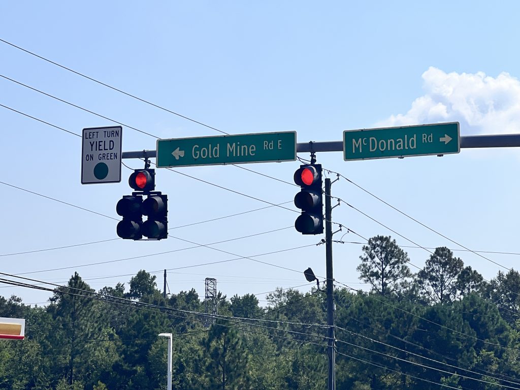 Traffic signals at Gold Mine Road and McDonald Street