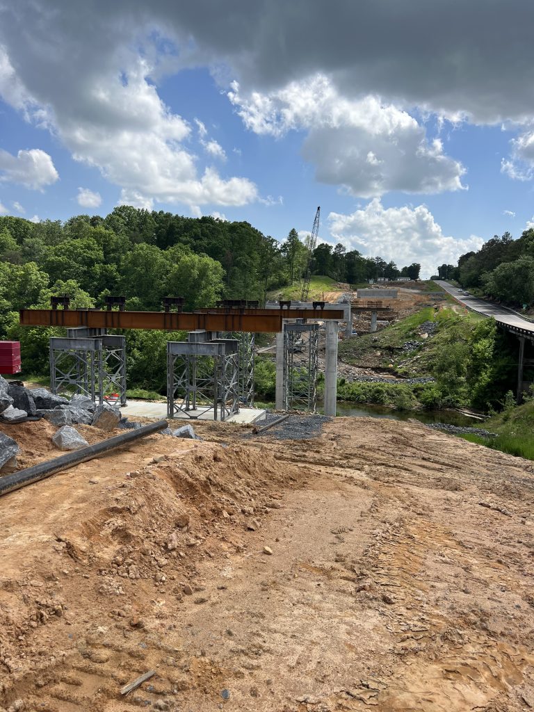 Construction site with piers, caps, and falsework prepared.