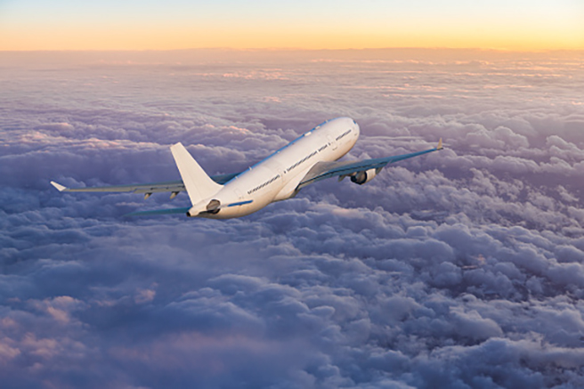 Airplane flying above clouds.