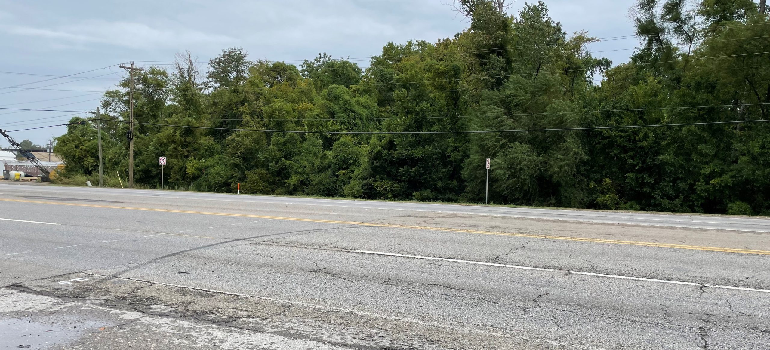 A highway with both newer and older pavement visible