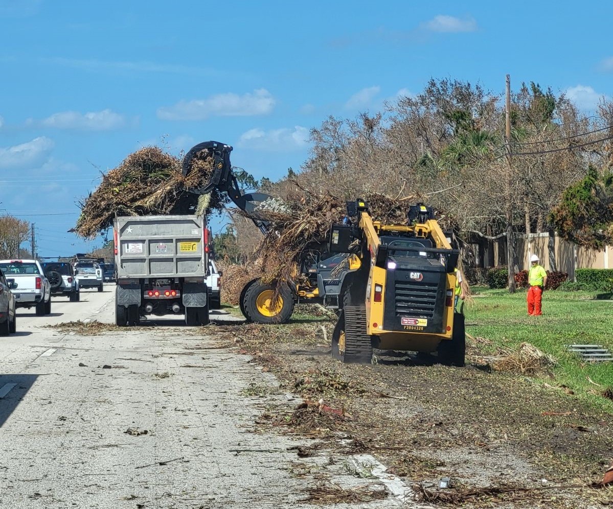 ALDOT clears roadside debris caused by the hurricanes in Florida.