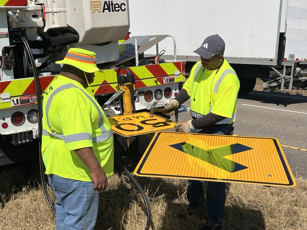 District 74 members in Ozark put together a road sign.