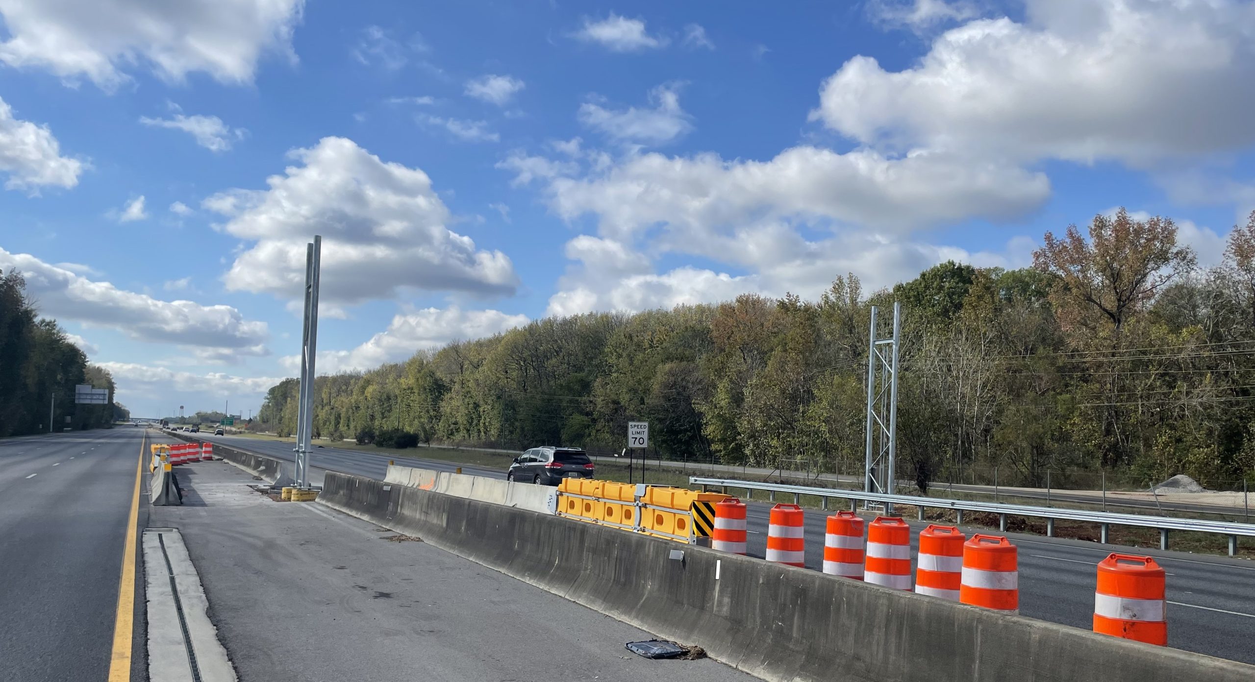 A road with metal structures on either side of it.