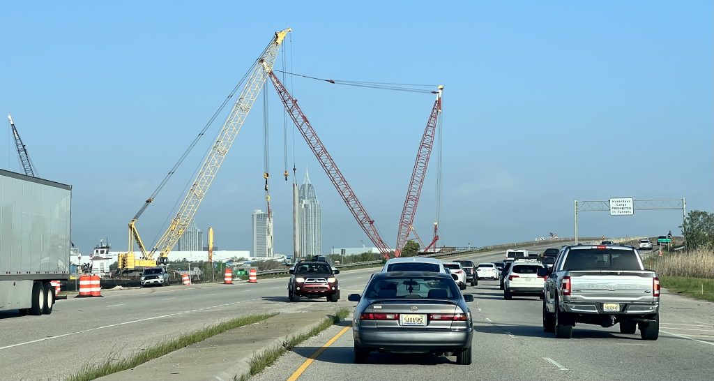 Traffic US 90 Causeway westbound approaching Tensaw River Bridge construction.