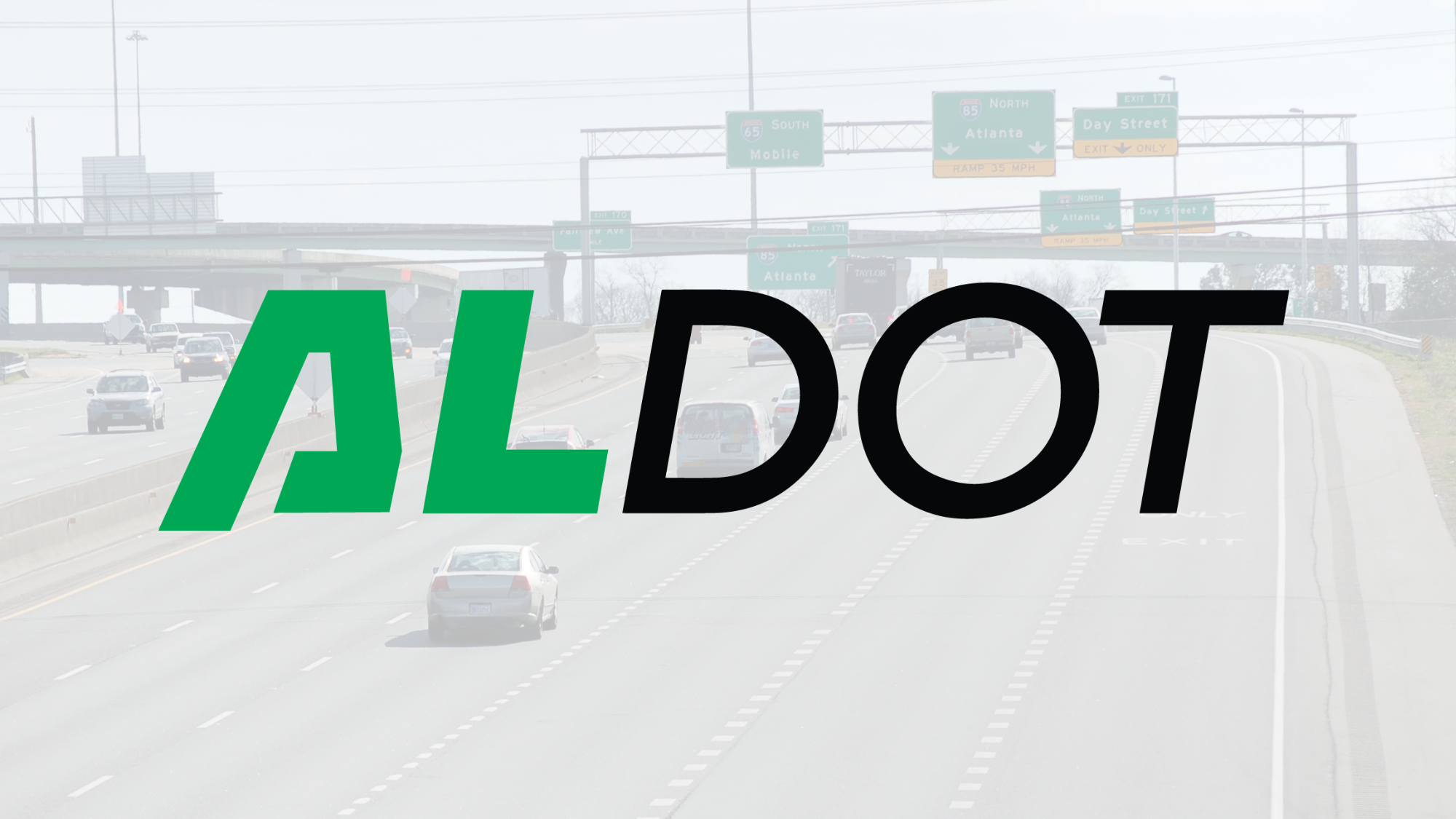 Interstate with cars driving and road signs. ALDOT logo over top.