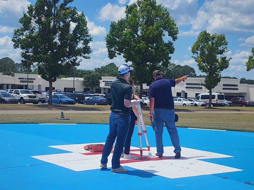 Photo of helipad inspectors inspecting the helipad at Flowers Hospital in Dothan, Alabama.