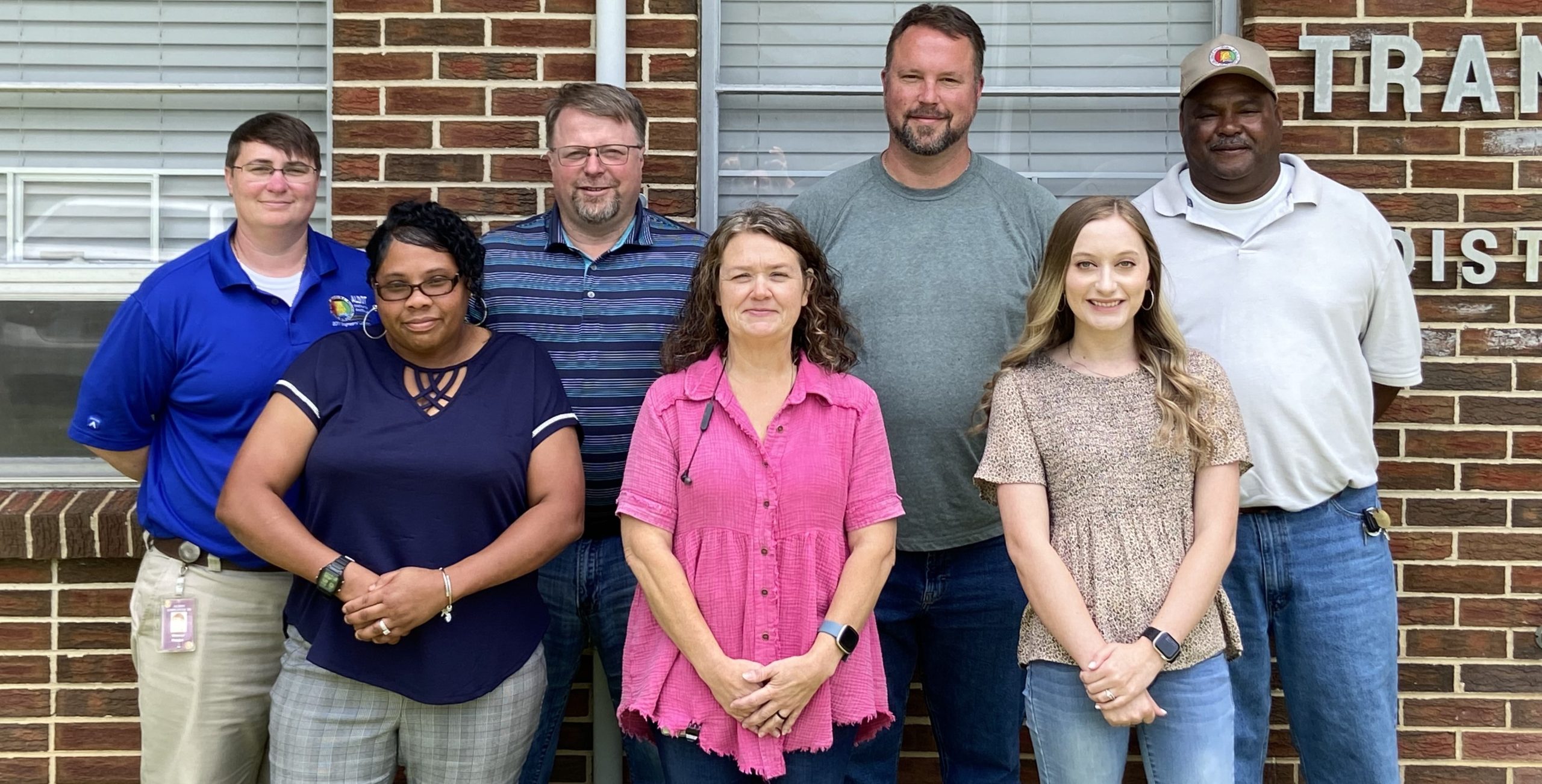 Members of the Jasper District pose in front of the district office.