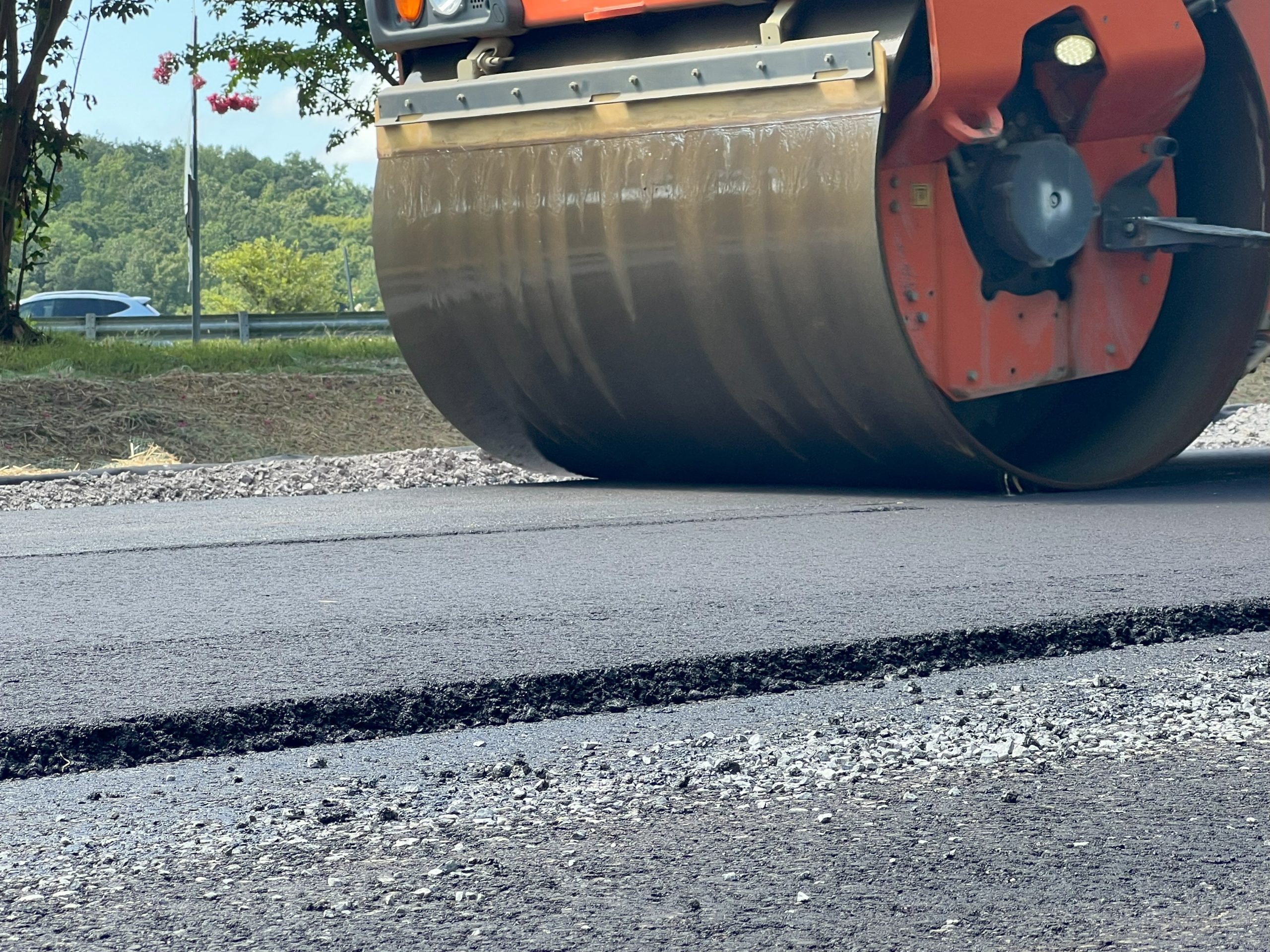Steamroller resurfacing Trussville interstate ramps