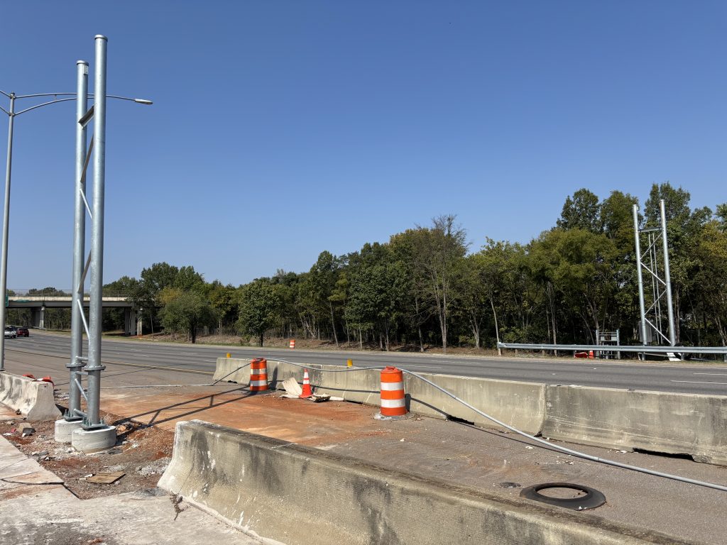Metal uprights stand on each side of a roadway.