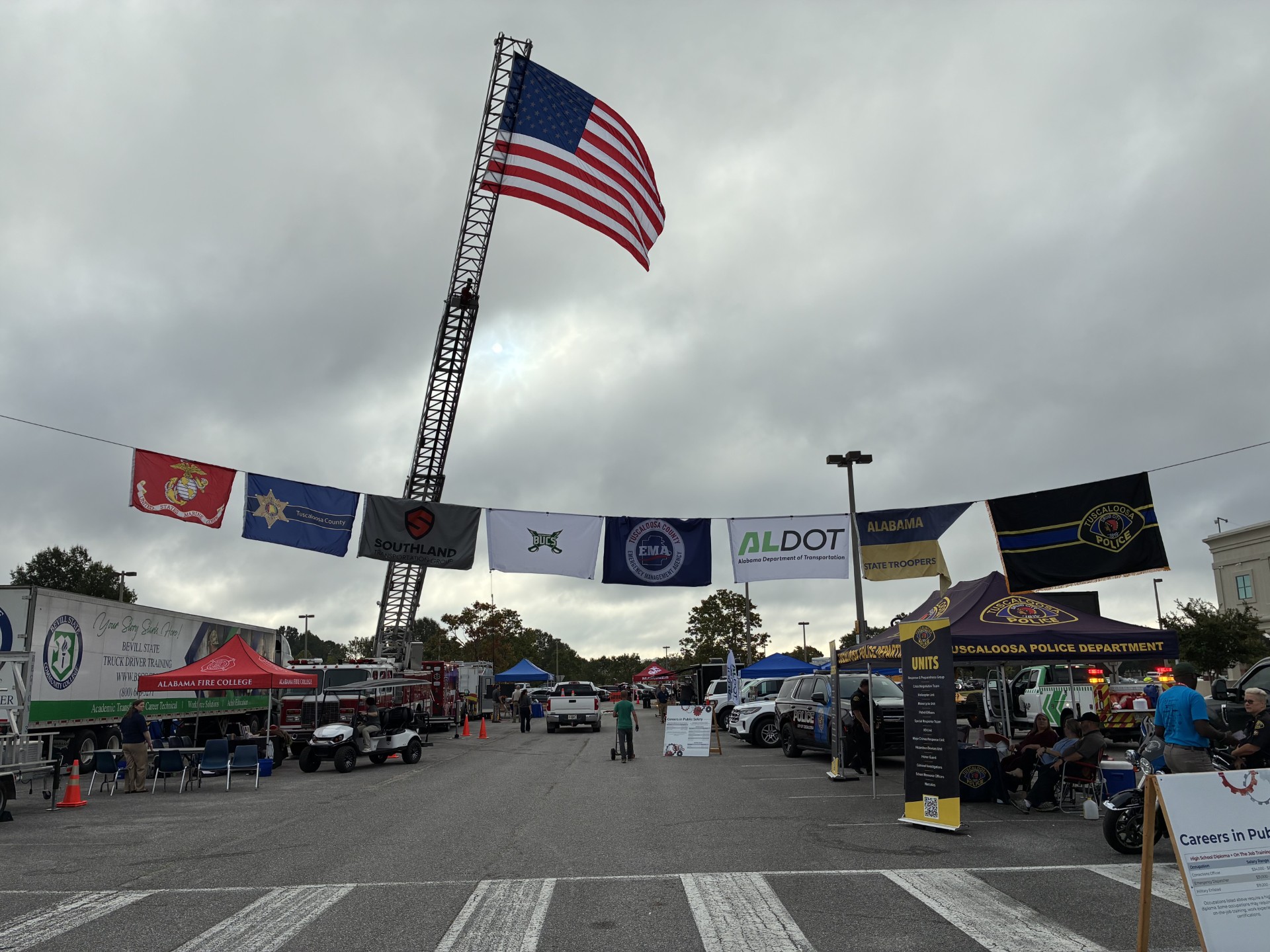 An ALDOT flag hangs with other flags at the ninth annual West Alabama Worlds of Work (WOW) career expo.