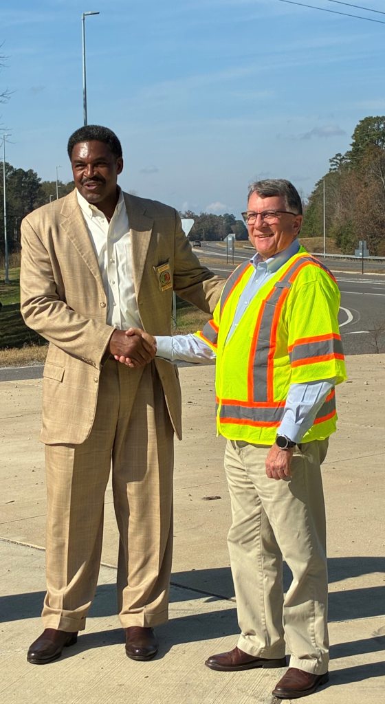 ALDOT and Sumter County officials smile at the completion of a roadway lighting project on US-80 near Bellamy.