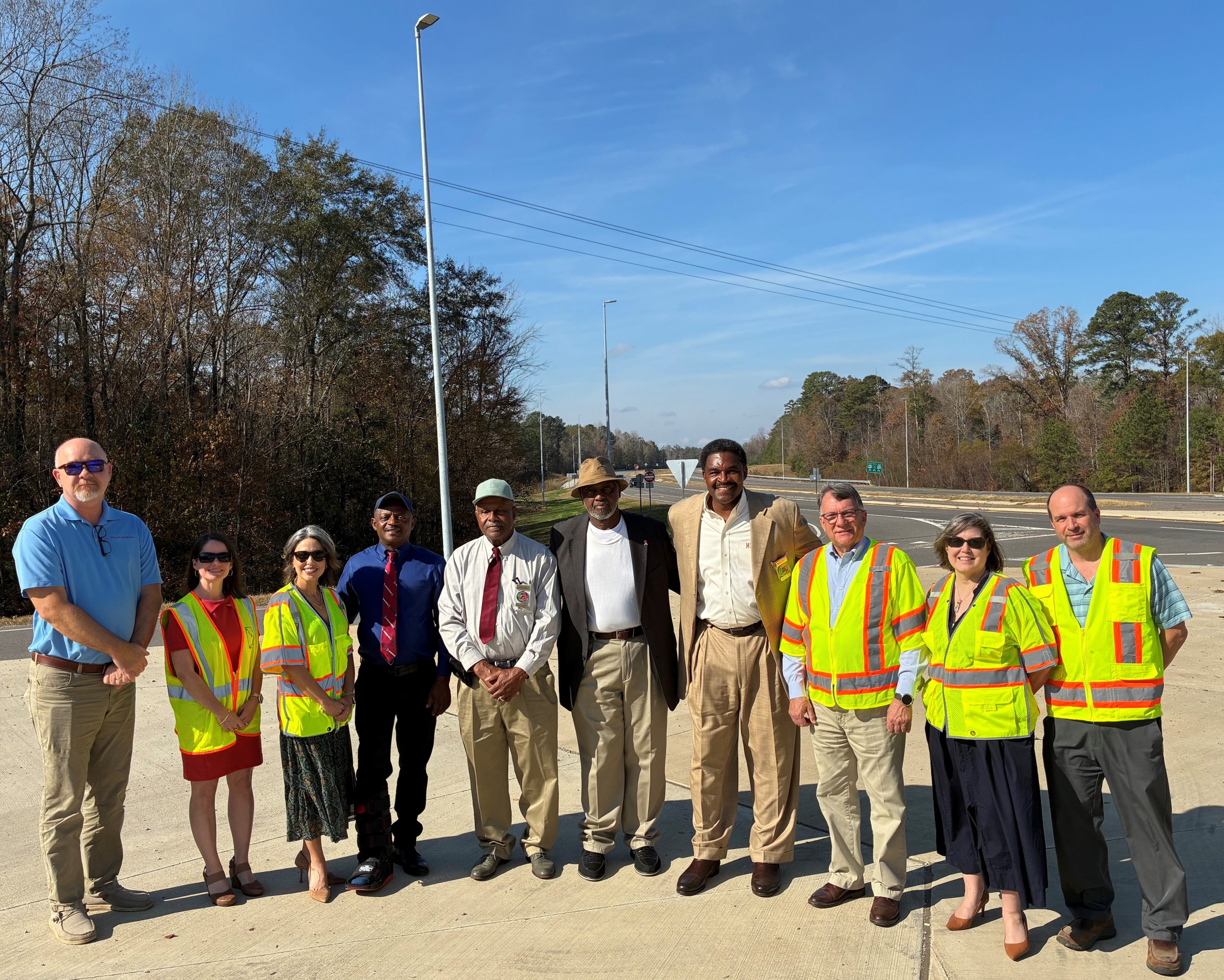 ALDOT and Sumter County officials smile at the completion of a roadway lighting project near Bellamy.