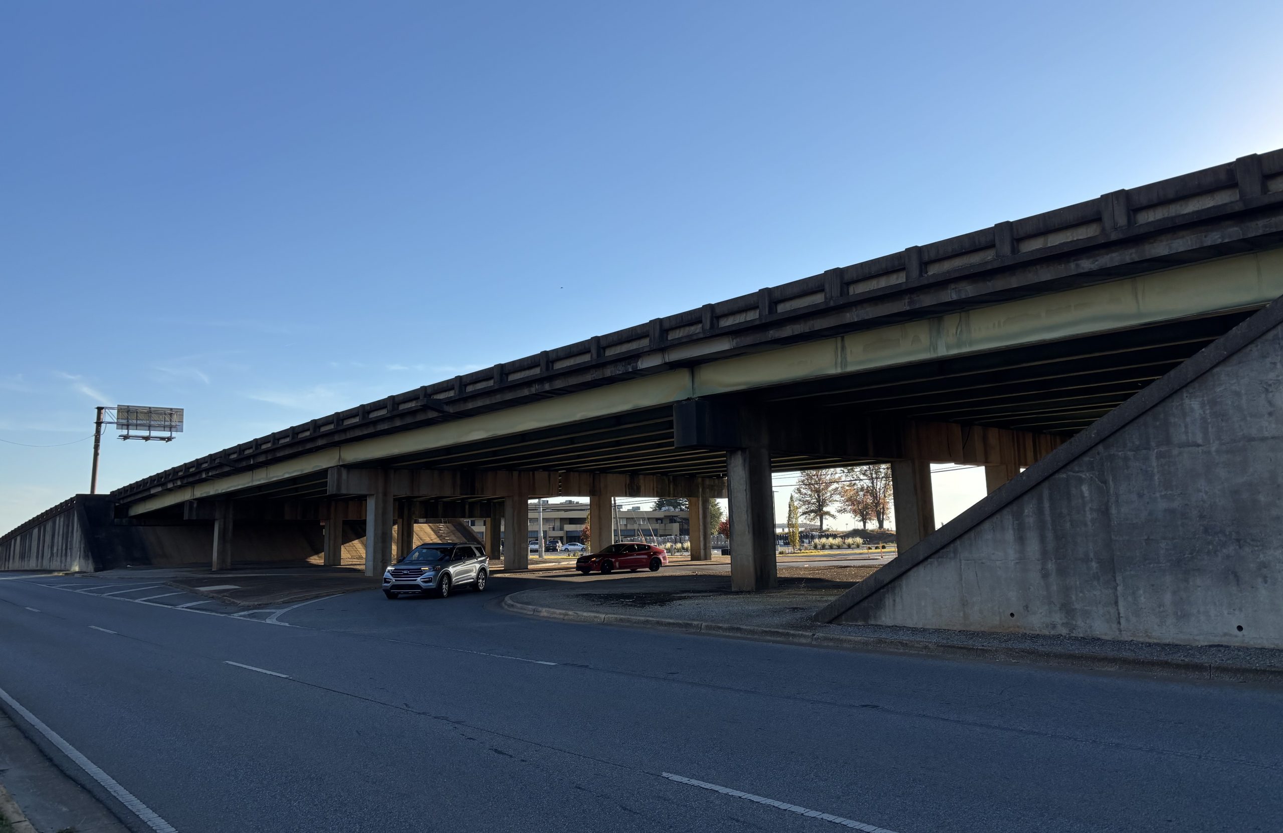 An overpass next to a service road