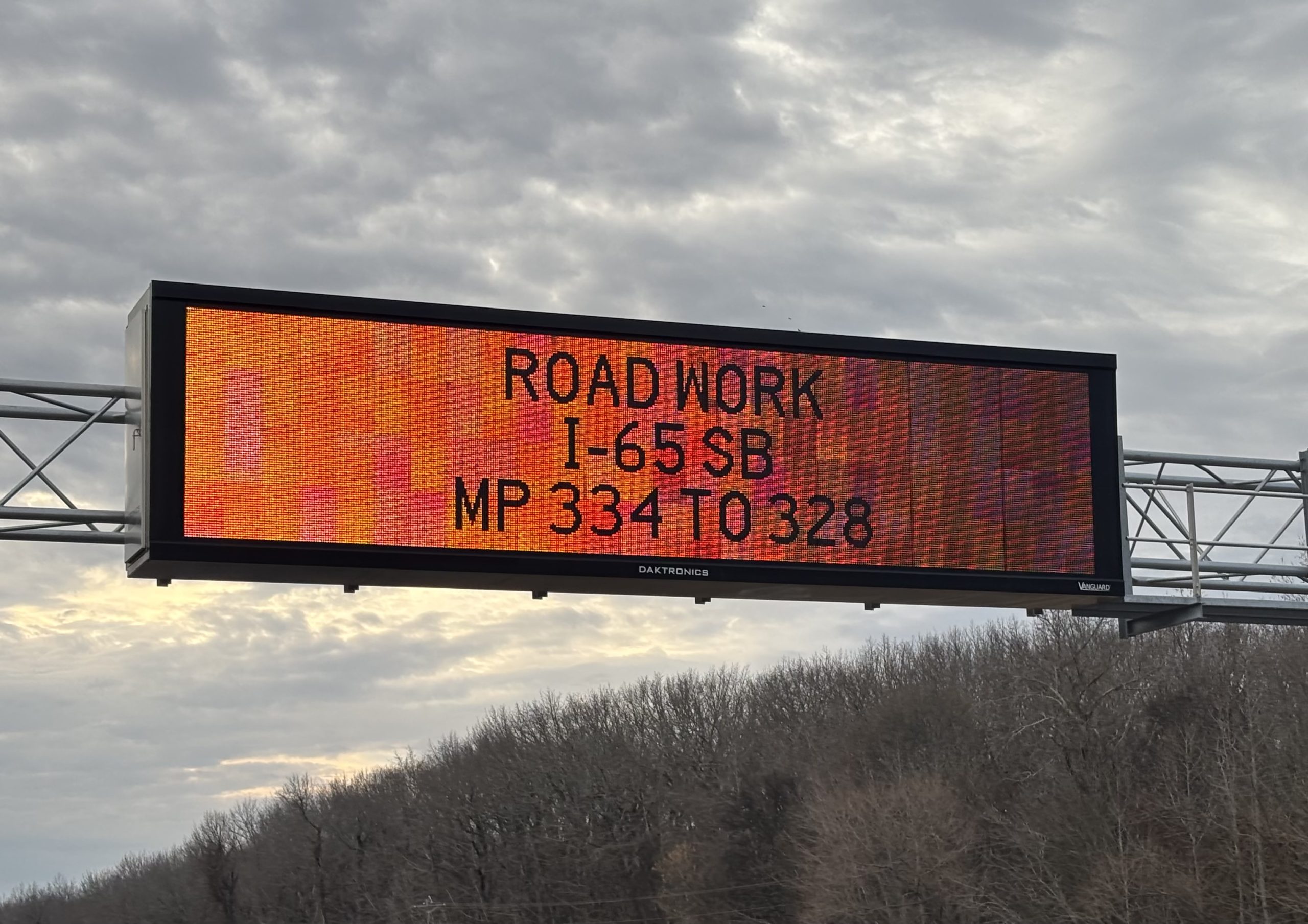 Photo of a traffic message board stating information about the Road work on I-65 at MP 334 to 328