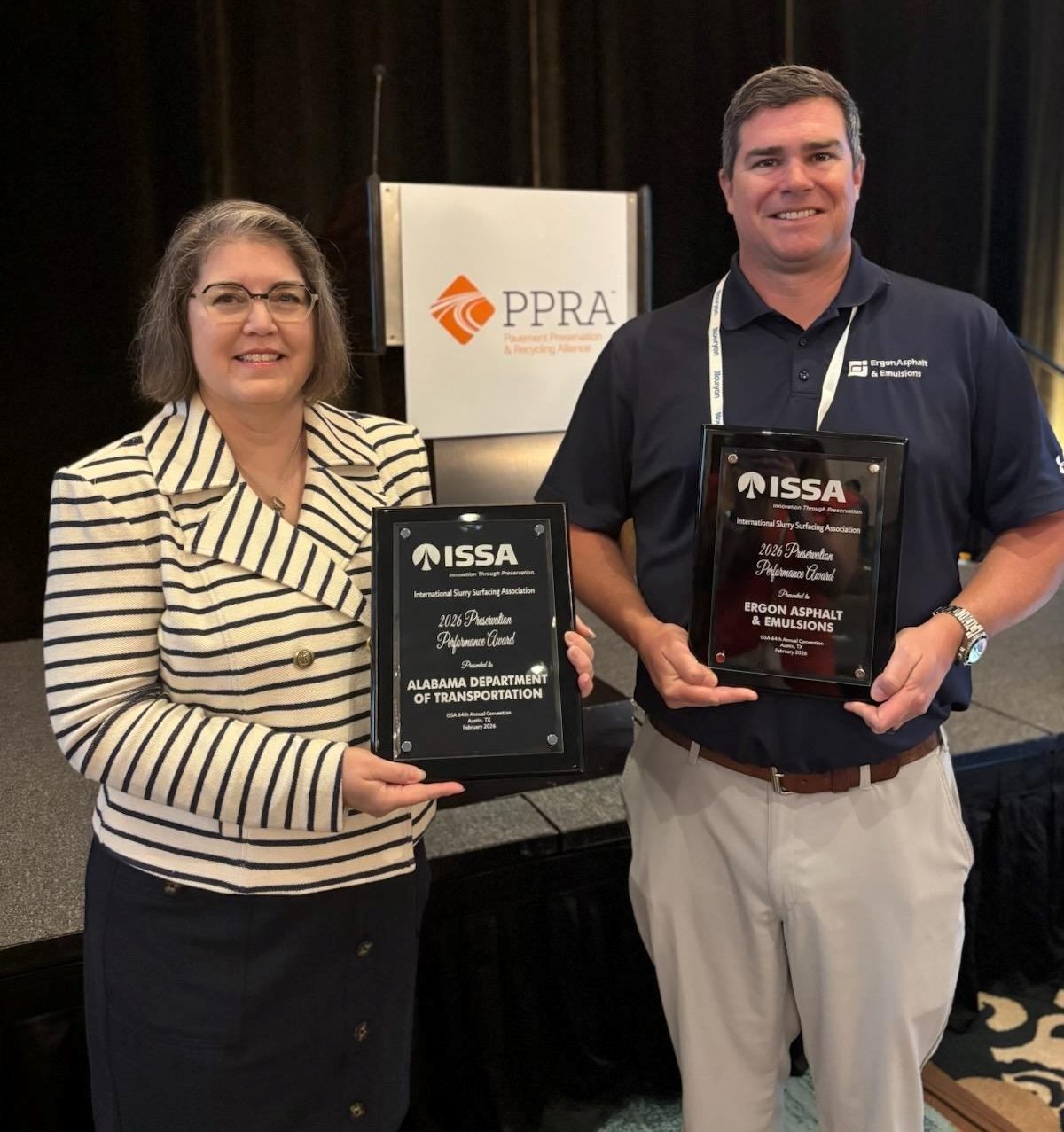 Lyndi Blackburn receives the International Slurry Surfacing Association award for pavement preservation on behalf of ALDOT.