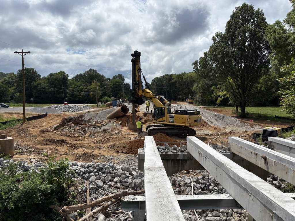 Drilling equipment, seen south of the creek from the remains of the old SR-243 bridge. 