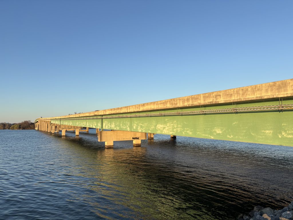 One of the US-431 bridges, its girders painted green, stretches across the Tennessee River.