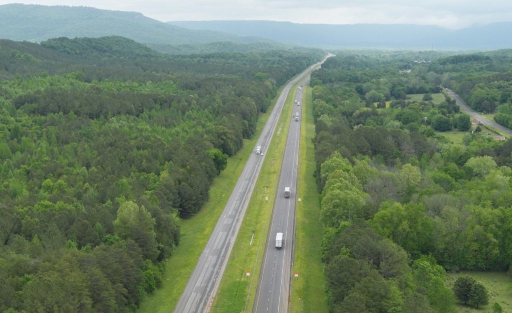 An aerial view of I-59, juxtaposes a new roadway on one side and an old one on the other