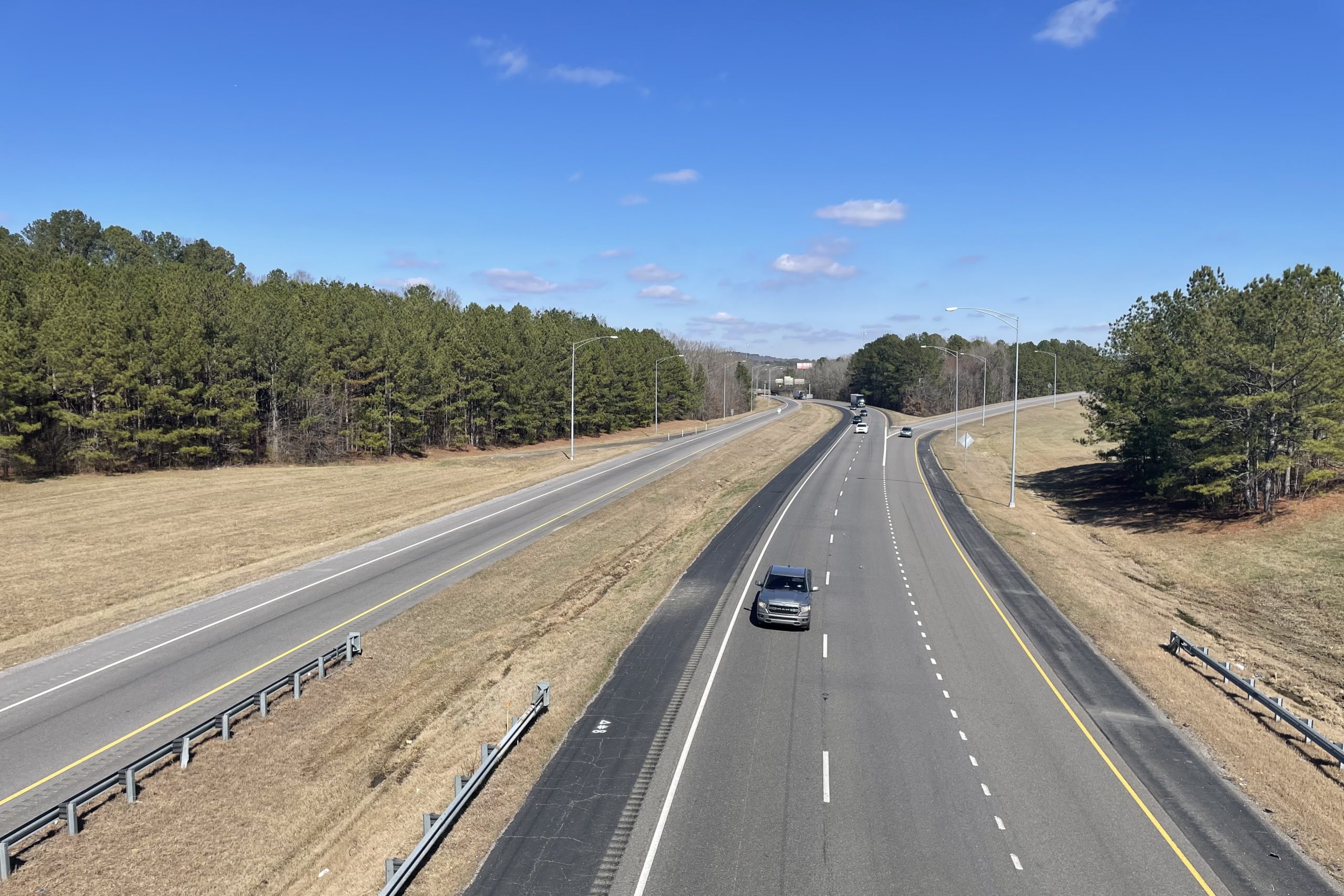 A ramp merges onto an interstate highway.