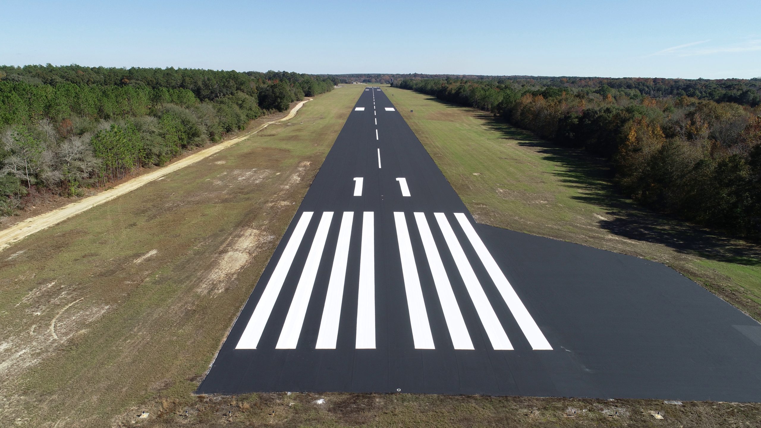 Aerial view of a newly resurfaced runway at an Alabama public-use airport supported by Alabama airport improvement grants through ALDOT's Airport Improvement Funding Program.