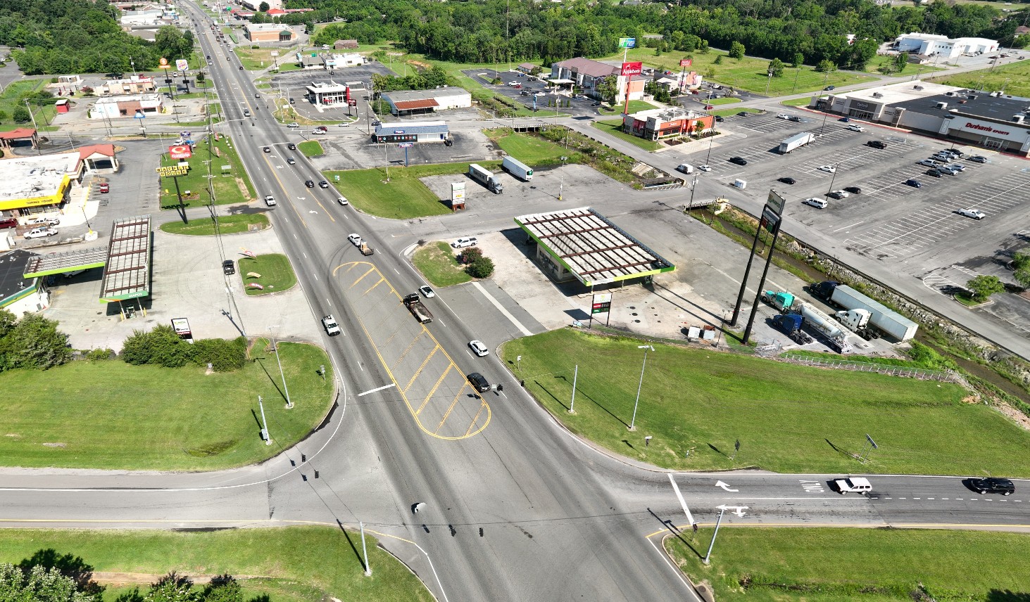An aerial view of a four-lane highway with multiple intersections.