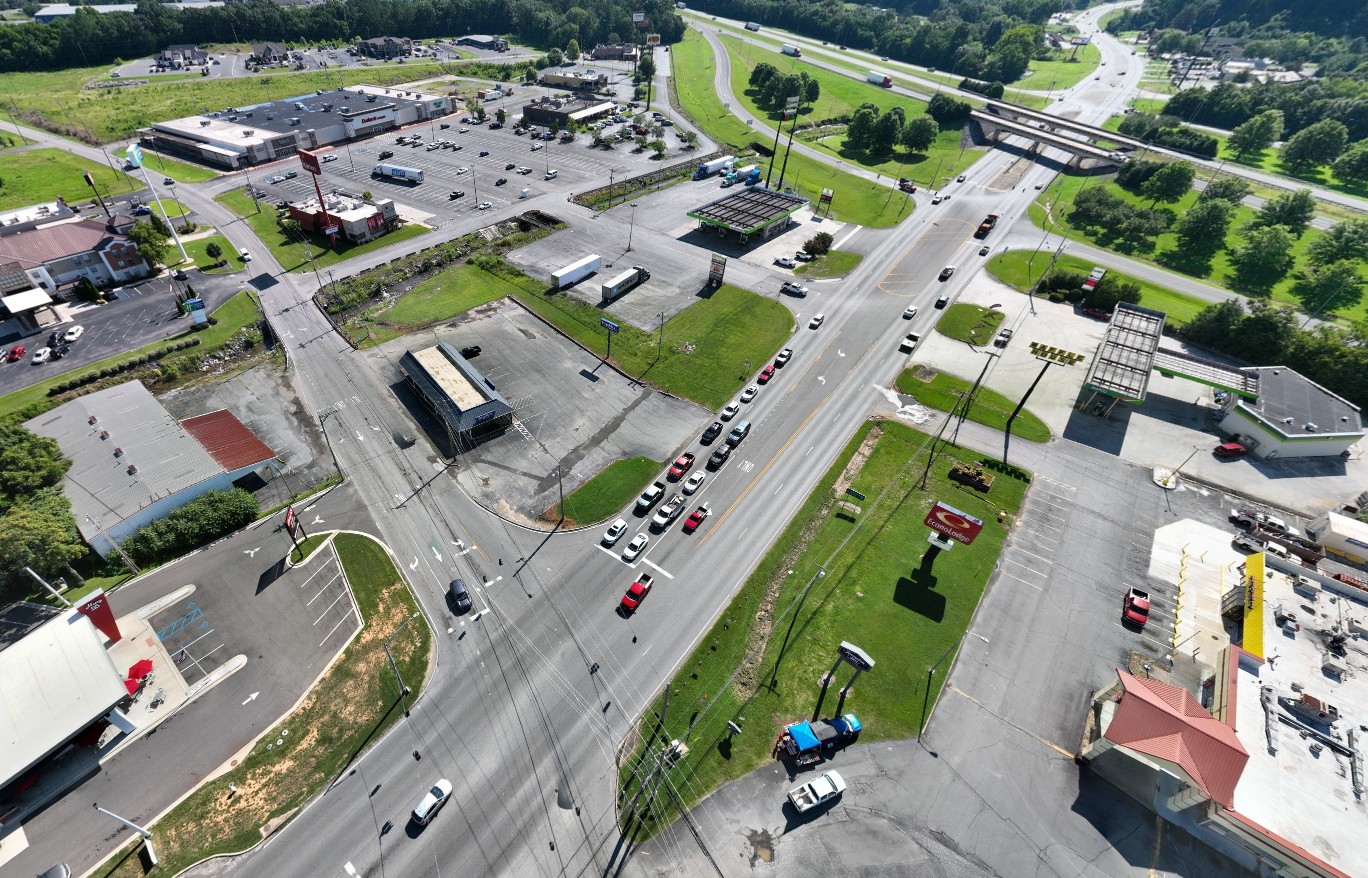 An aerial view of the project area, a four-lane highway with multiple intersections.