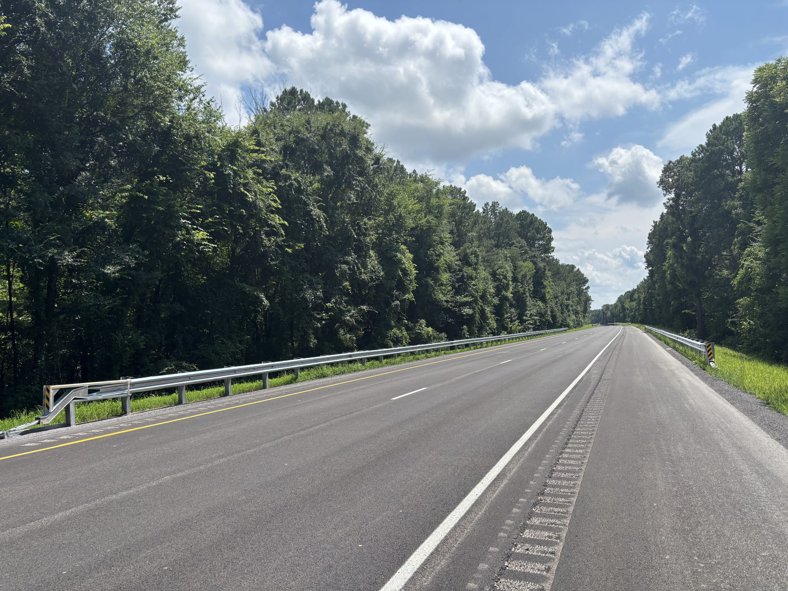 A new two-lane roadway with no traffic on it.