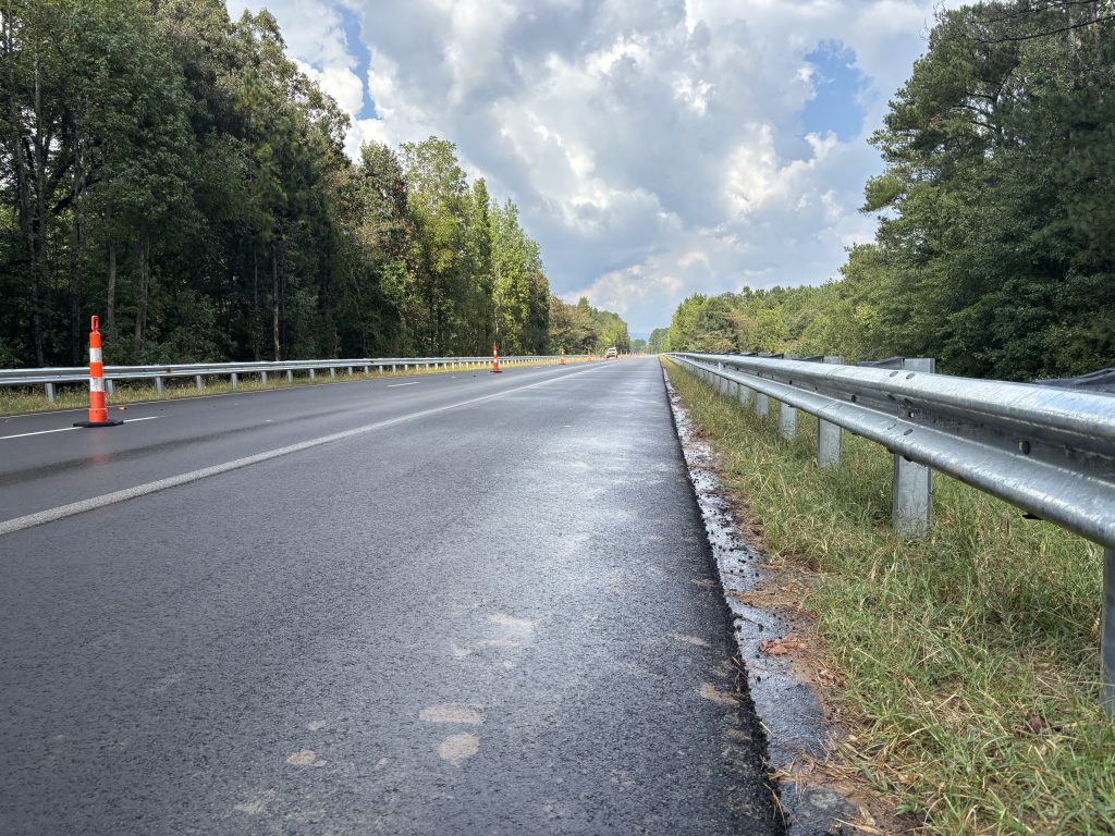 Cones line the center of a new roadway.