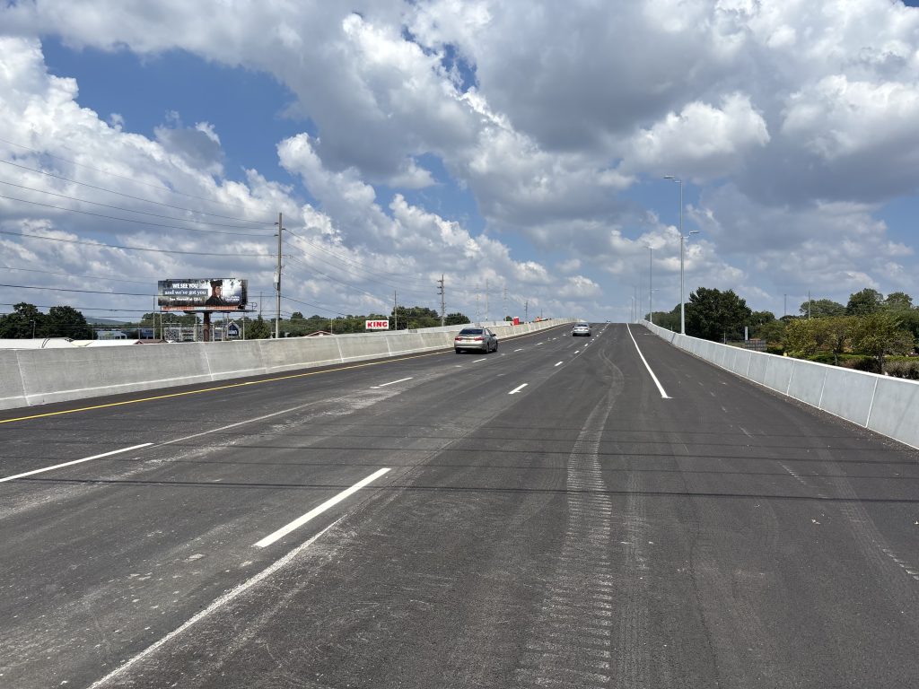 Traffic travels on an overpass.